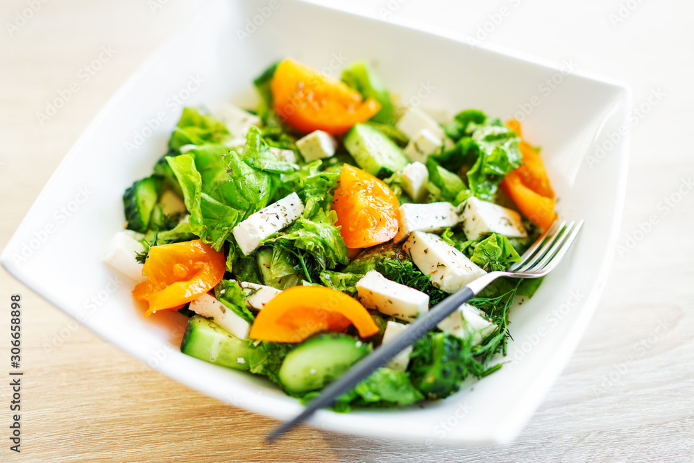 Fresh salad with cheese and tomatoes Fresh salad with cheese and tomatoes