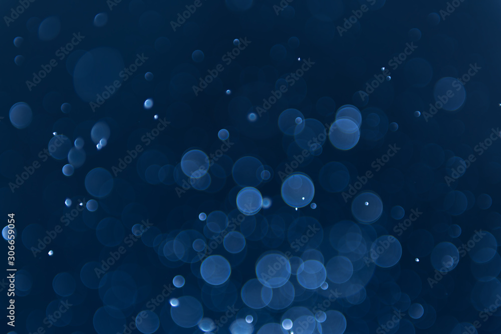 abstract sparkle bokeh light effect with navy blue background abstract sparkle bokeh light effect with navy blue background