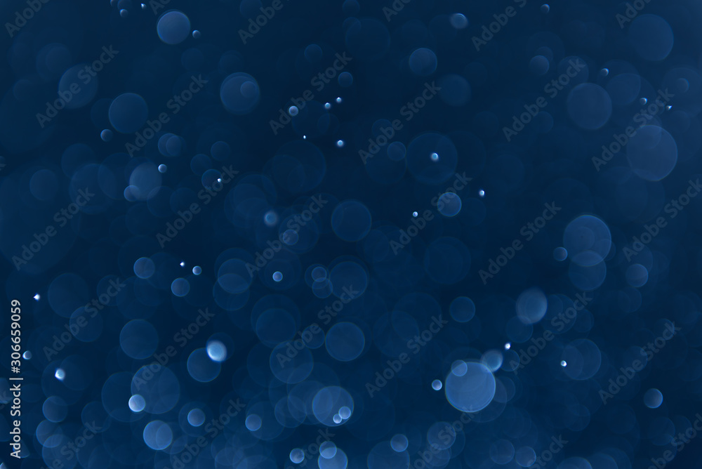 abstract sparkle bokeh light effect with navy blue background - obrazy, fototapety, plakaty 