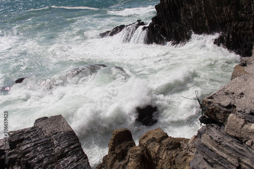 Marine landscape. Waves are crashing on rocks.