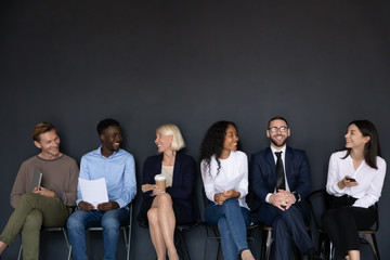 Happy different generations multiracial business people isolated on black background.