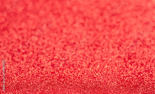 Sparkle red blured shiny glitter texture background . Christmas decoration backdrop .