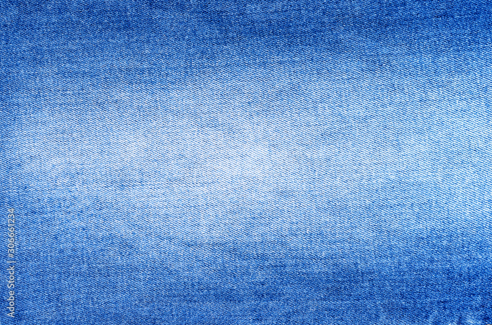 Close-up of modern young faded background jeans denim . Women and Men fashion accessory .Top view, copyspace. Close-up of modern young faded background jeans denim . Women and Men fashion accessory .Top view, copyspace.