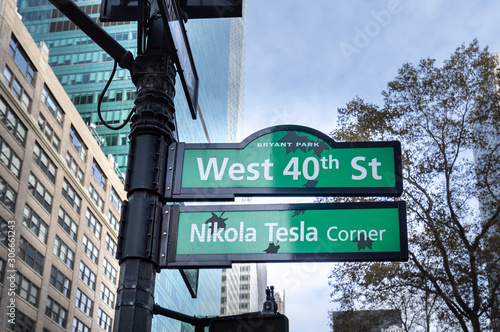 Nikola Tesla corner street sign in Bryant Park, commemorating the spot where the famous scientist fed his pigeons in New York City. photo