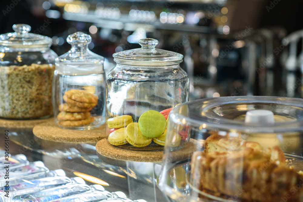 The coffee shop sells tasty and fresh sweets in glass jars. The coffee shop sells tasty and fresh sweets in glass jars.