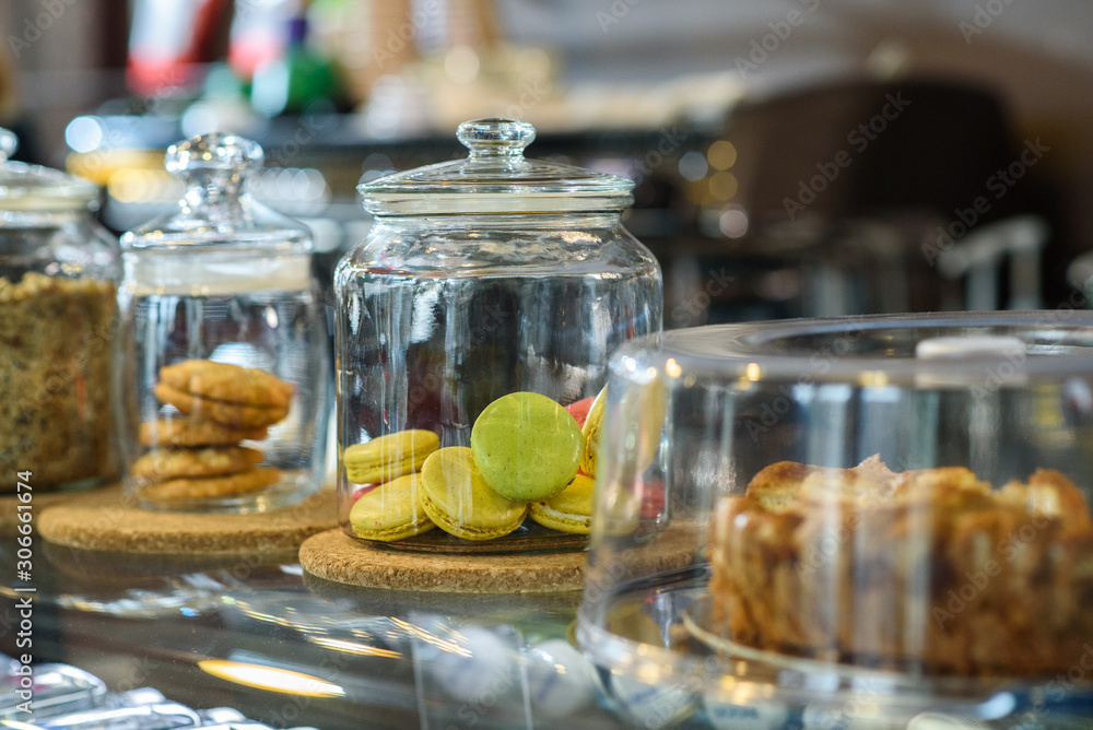 The coffee shop sells tasty and fresh sweets in glass jars. The coffee shop sells tasty and fresh sweets in glass jars.