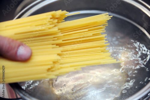 cook pasta at home - boiling water and spaghetti