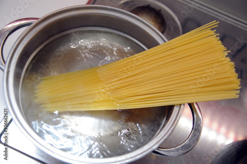 cook pasta at home - boiling water and spaghetti