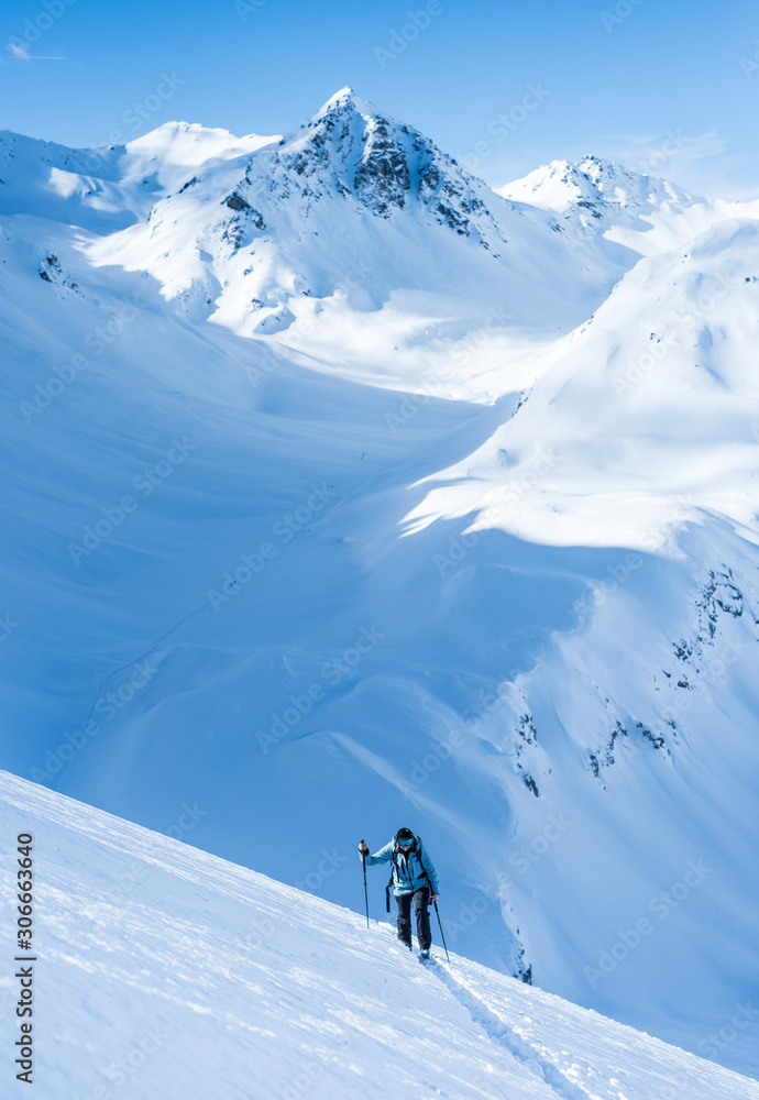 women backcountry skiing in the mountains
