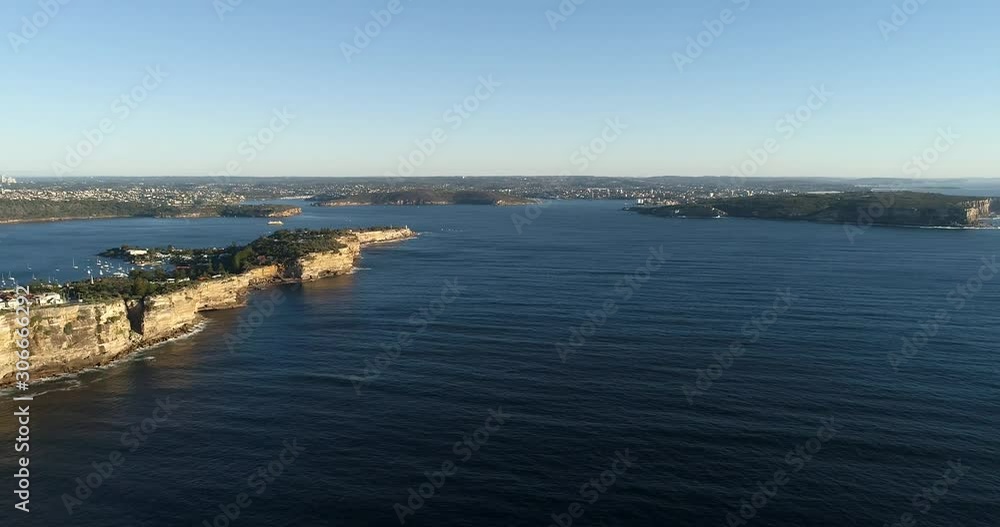 Cliffy coast of Greater Sydney around entrance to Sydney Harbour in wide rotation panoramic view from open Pacific ocean against Macquarie lighthouse. Cliffy coast of Greater Sydney around entrance to Sydney Harbour in wide rotation panoramic view from open Pacific ocean against Macquarie lighthouse.