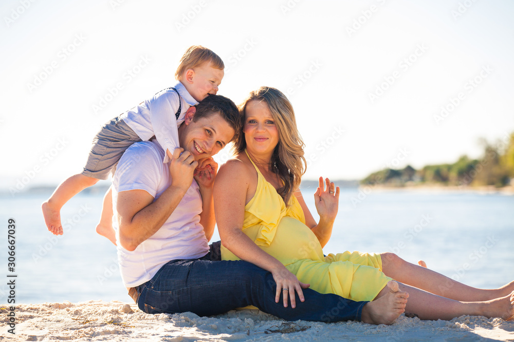 Happy pregnant woman with long hair on a sunny day, beach and park Happy pregnant woman with long hair on a sunny day, beach and park