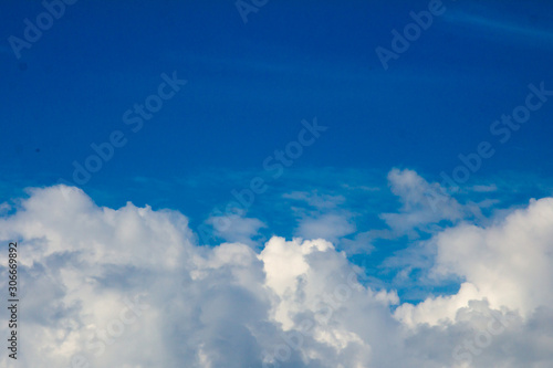 White clouds on the blue sky background