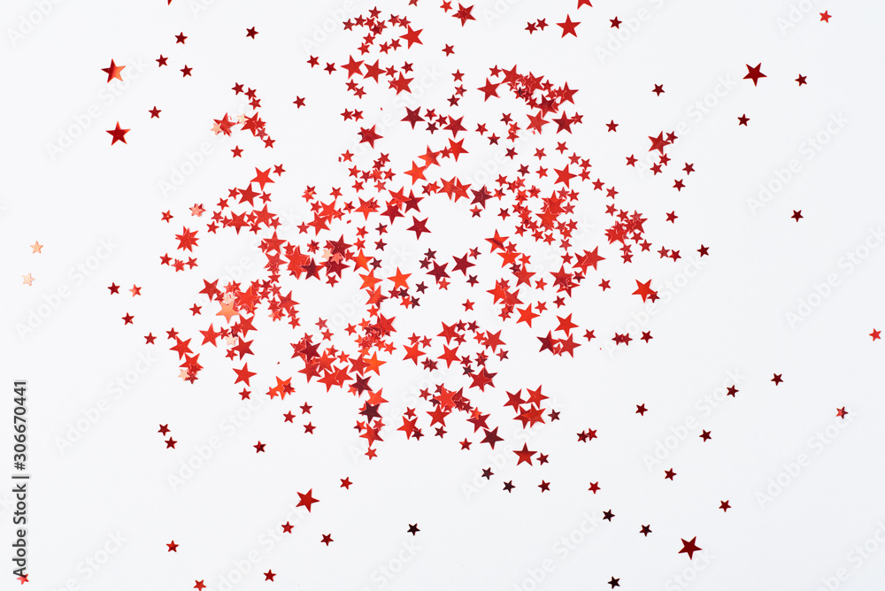 Abstract background with red confetti in shape of star on a white background Abstract background with red confetti in shape of star on a white background