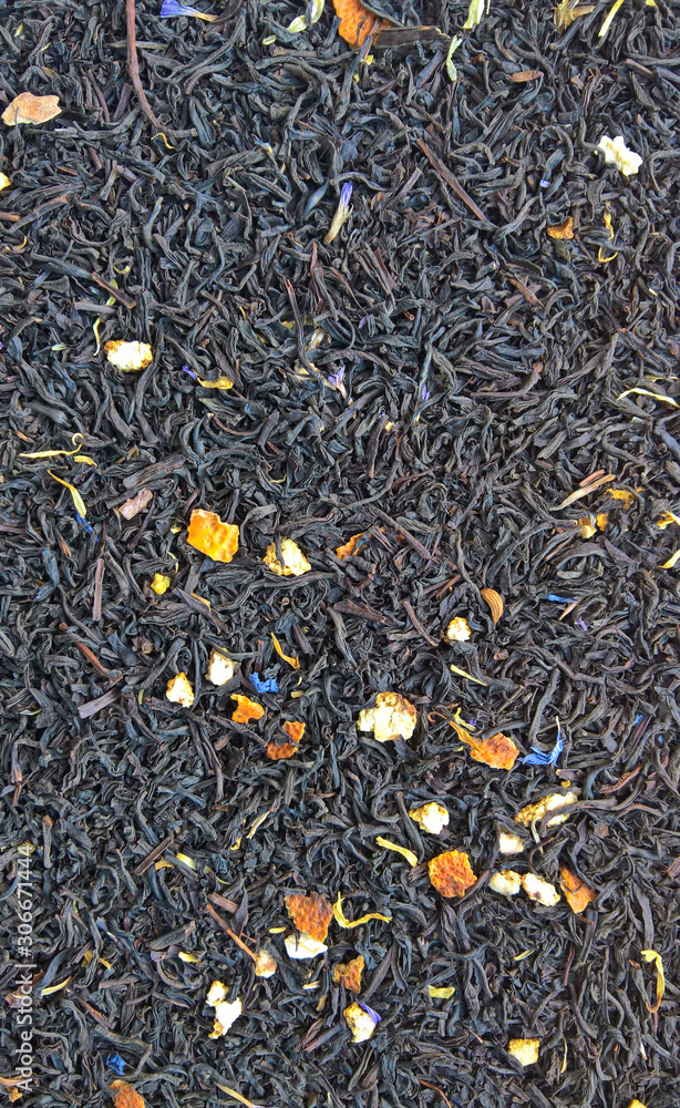 dry black tea leaves with fruit background dry black tea leaves with fruit background