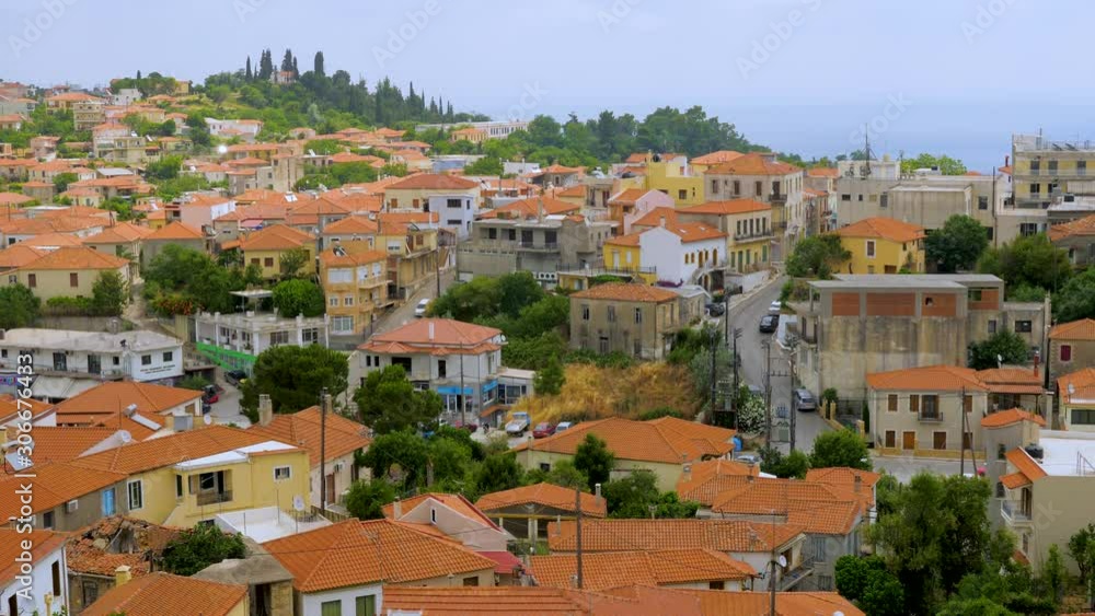 Travel concept. European view of the city, town. Panorama of old city of Kymi, Greece. Houses with red roofs, cityscape of Greek town, village, Greece. Evia Euboea island, Greece. Top view Travel concept. European view of the city, town. Panorama of old city of Kymi, Greece. Houses with red roofs, cityscape of Greek town, village, Greece. Evia Euboea island, Greece. Top view