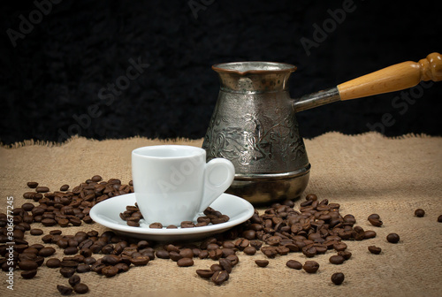 Coffee copper and white cup. Greek coffee with water and coffee pot. Turkish coffee and beans. White mug cafe.
