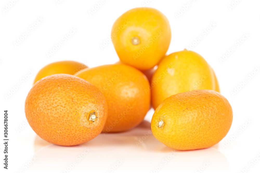Group of six whole tasty orange kumquat heap isolated on white background Group of six whole tasty orange kumquat heap isolated on white background