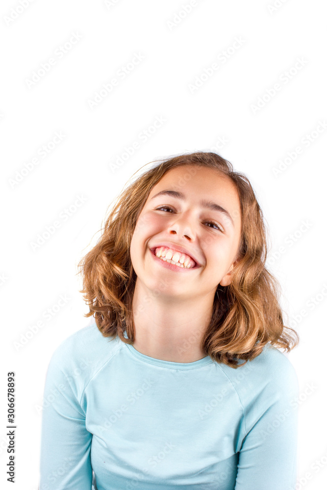 Pretty cute laughing teenager girl with curly hair isolated Pretty cute laughing teenager girl with curly hair isolated