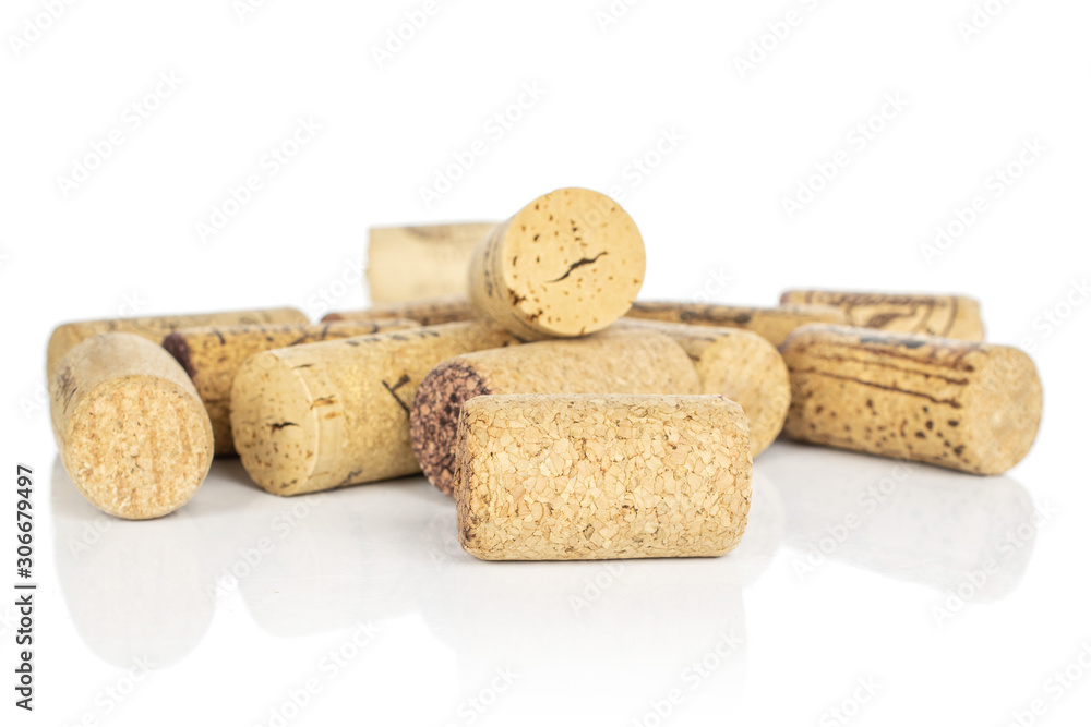 Lot of whole common wine cork heap isolated on white background