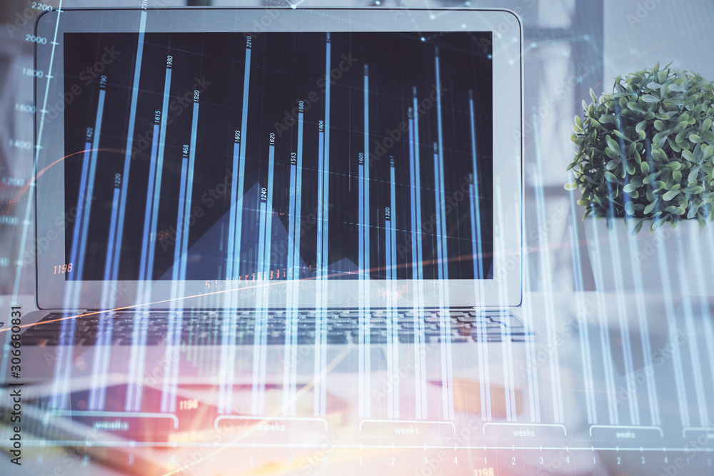 Stock market graph on background with desk and personal computer. Multi exposure. Concept of financial analysis. Stock market graph on background with desk and personal computer. Multi exposure. Concept of financial analysis.
