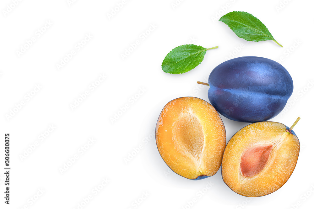 Fototapeta premium fresh blue plum and half with leaves isolated on white background with copy space for your text. Top view. Flat lay