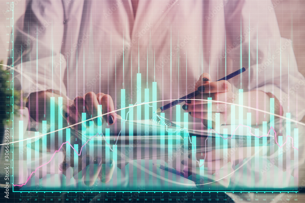 Financial forex graph drawn over hands taking notes background. Concept of research. Double exposure Financial forex graph drawn over hands taking notes background. Concept of research. Double exposure