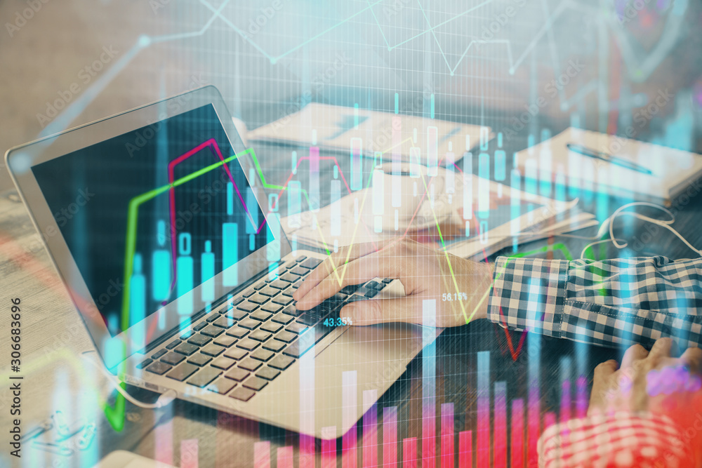 Double exposure of forex chart with man working on computer on background. Concept of market analysis. Double exposure of forex chart with man working on computer on background. Concept of market analysis.