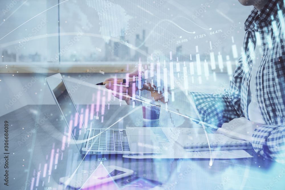 Double exposure of stock market chart with man working on computer on background. Concept of financial analysis. Double exposure of stock market chart with man working on computer on background. Concept of financial analysis.