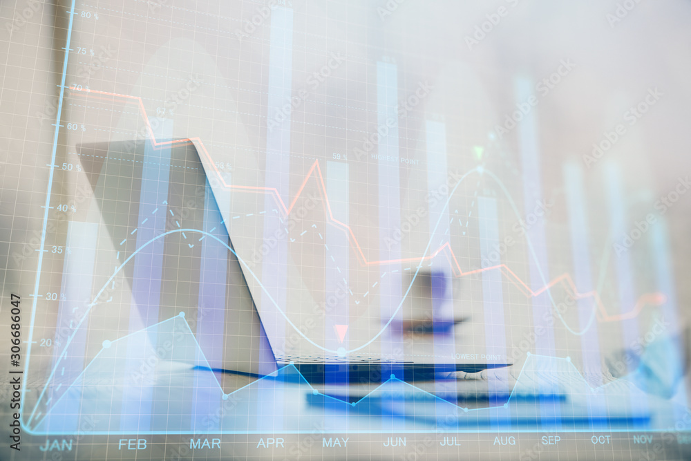 Double exposure of graph and financial info and work space with computer background. Concept of international online trading. Double exposure of graph and financial info and work space with computer background. Concept of international online trading.