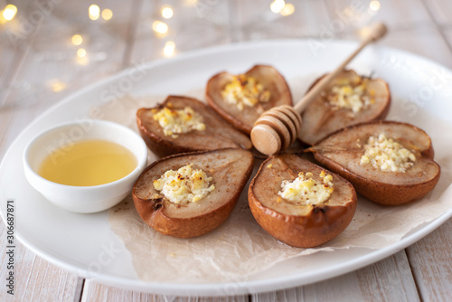 Baked pears with cheese, cinnamon, honey