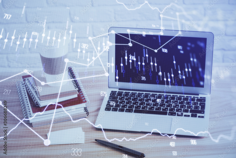 Financial graph colorful drawing and table with computer on background. Multi exposure. Concept of international markets. Financial graph colorful drawing and table with computer on background. Multi exposure. Concept of international markets.