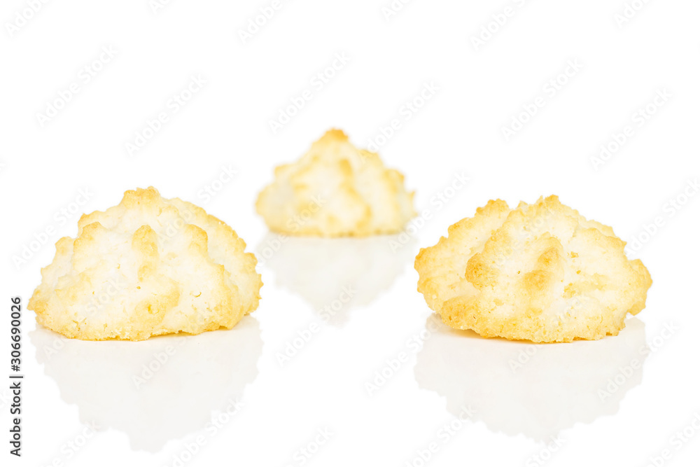 Group of three whole homemade golden coconut biscuit isolated on white background Group of three whole homemade golden coconut biscuit isolated on white background