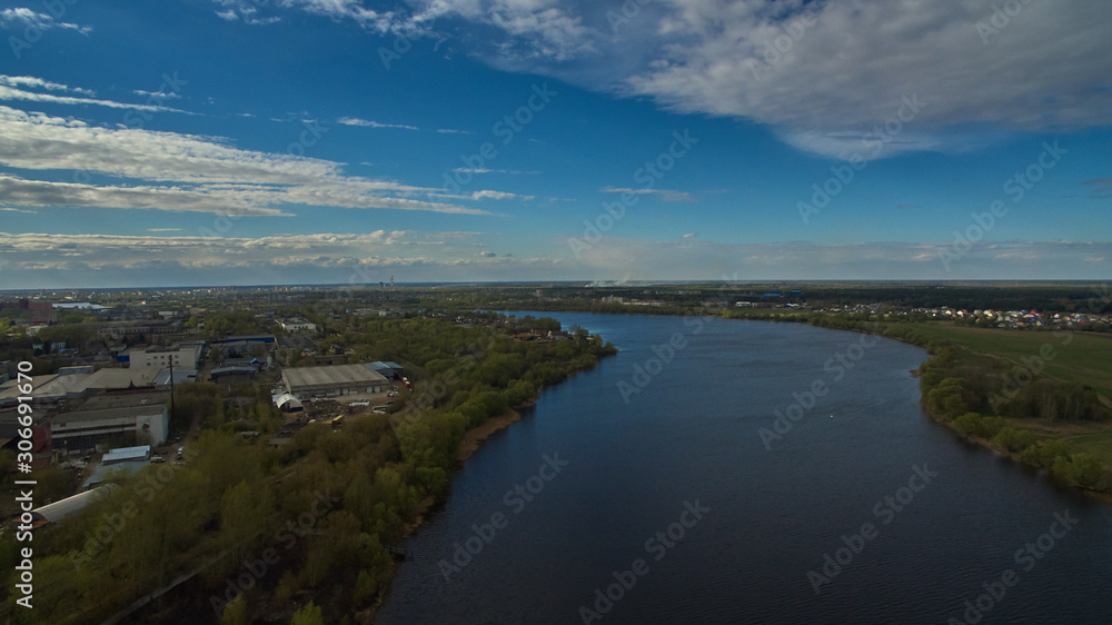 Aerial landscape with river, town, nature and blue sky