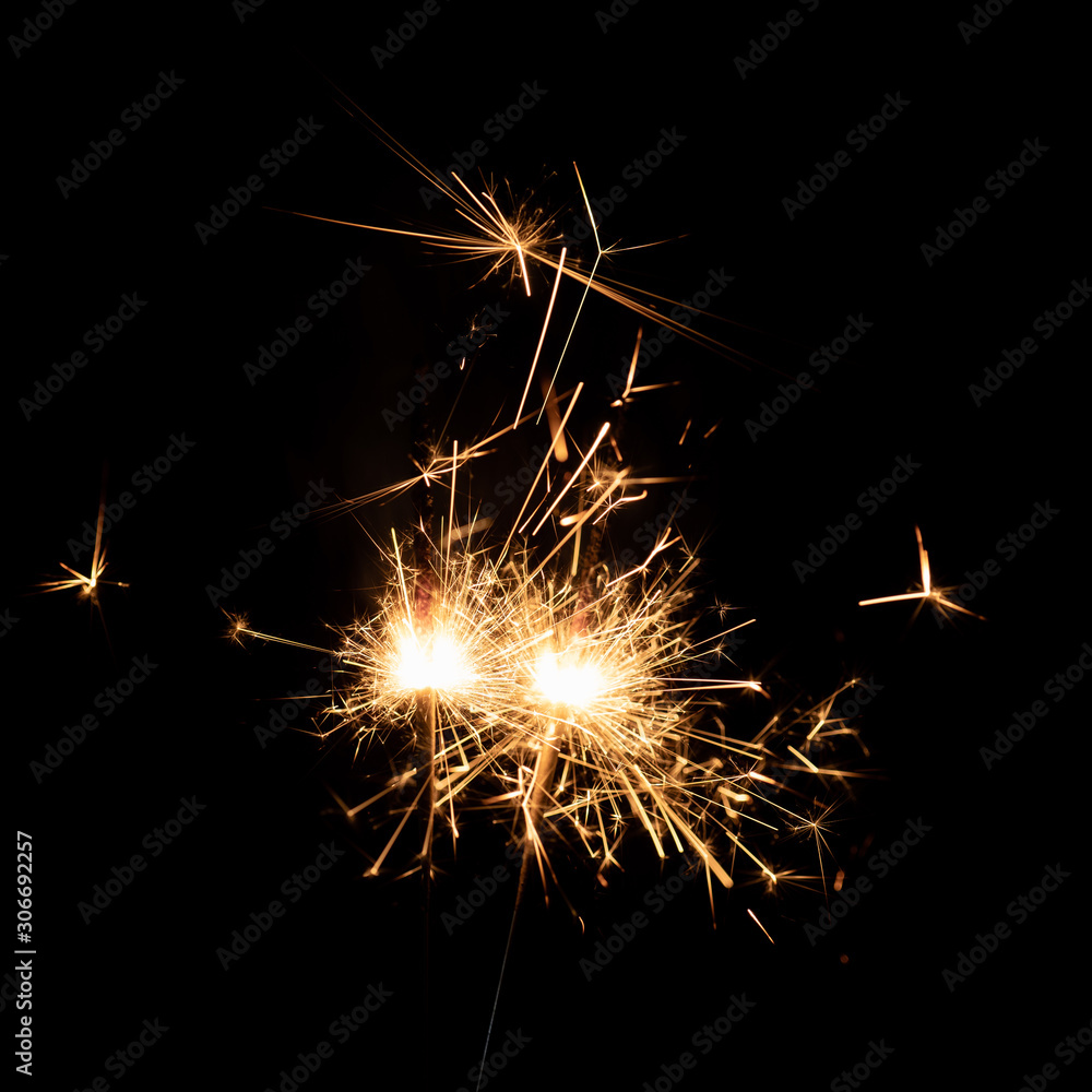 Firework sparkler burning isolated black background, shining fire flame, celebration festival happy holiday new year and merry christmas concept.