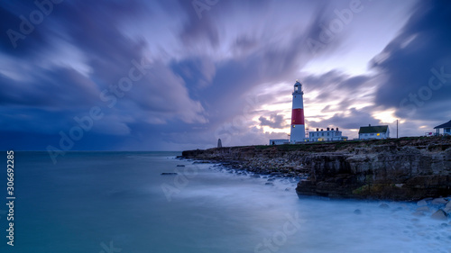 Portland Bill Light house with a stormy sunset
