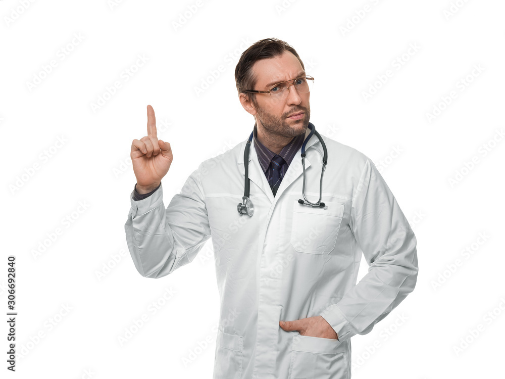 Photo of male doctor with stethoscope and keeps finger in attention sign. Isolated on white. Photo of male doctor with stethoscope and keeps finger in attention sign. Isolated on white.