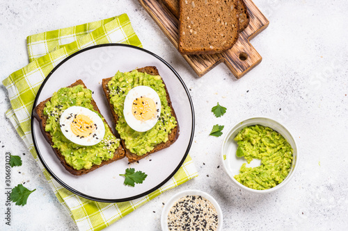 Avocado Sandwiches on white background. photo