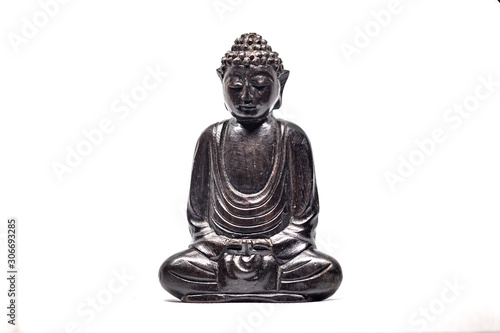 buddha statue meditating with a white background