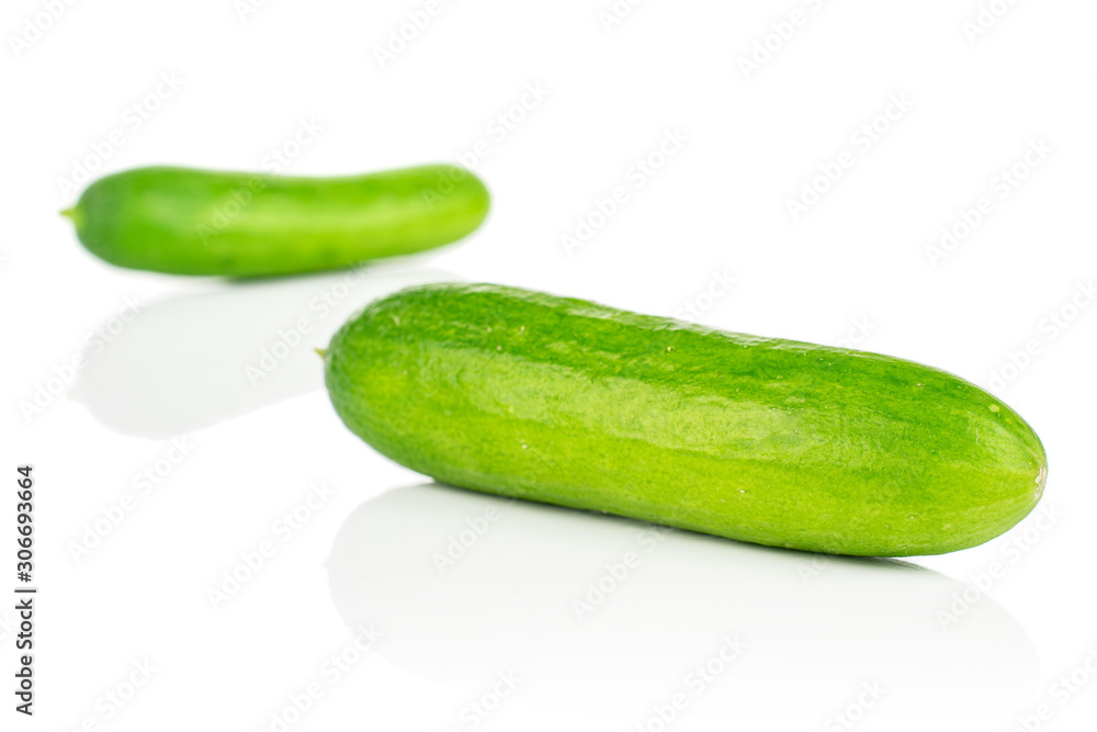 Group of two whole fresh green baby cucumber isolated on white background Group of two whole fresh green baby cucumber isolated on white background