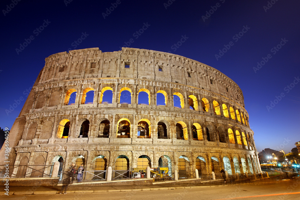 Night view of the Colosseum also known as the Flavian Amphitheater. The Colosseum is an ancient Roman amphitheater in the center of Rome, Italy.
