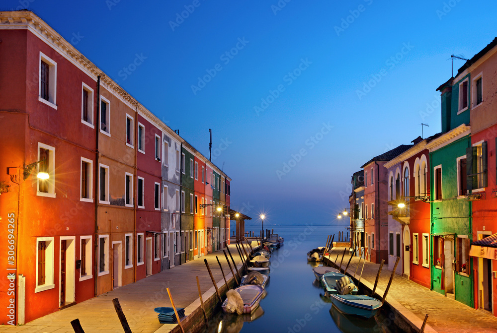 Night falling in picturesque and colorful Burano island, Venice, Veneto, Italy. 