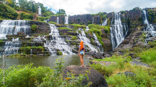 Aerial view for travel girl near beautiful Pongour waterfall in Vietnam. Travelling concept .Beautiful nature background. photo