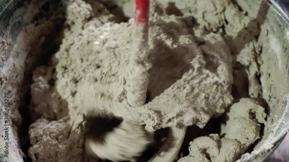 Plastering mortar machine. Automatic plaster. Repairing or renovating house or apartment. Builder at construction professional