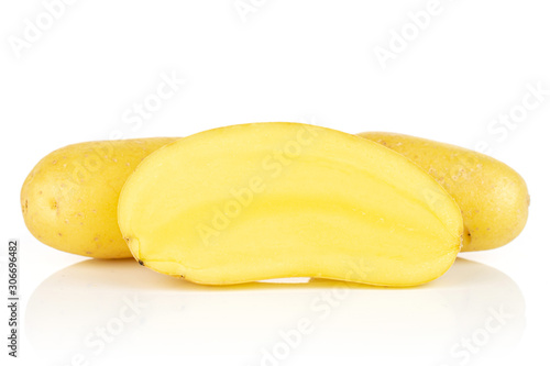 Group of two whole one half of pale yellow potato isolated on white background