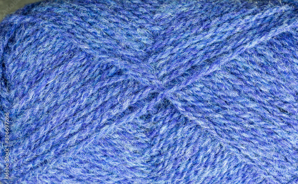 background of ball of shetland wool in blue background of ball of shetland wool in blue