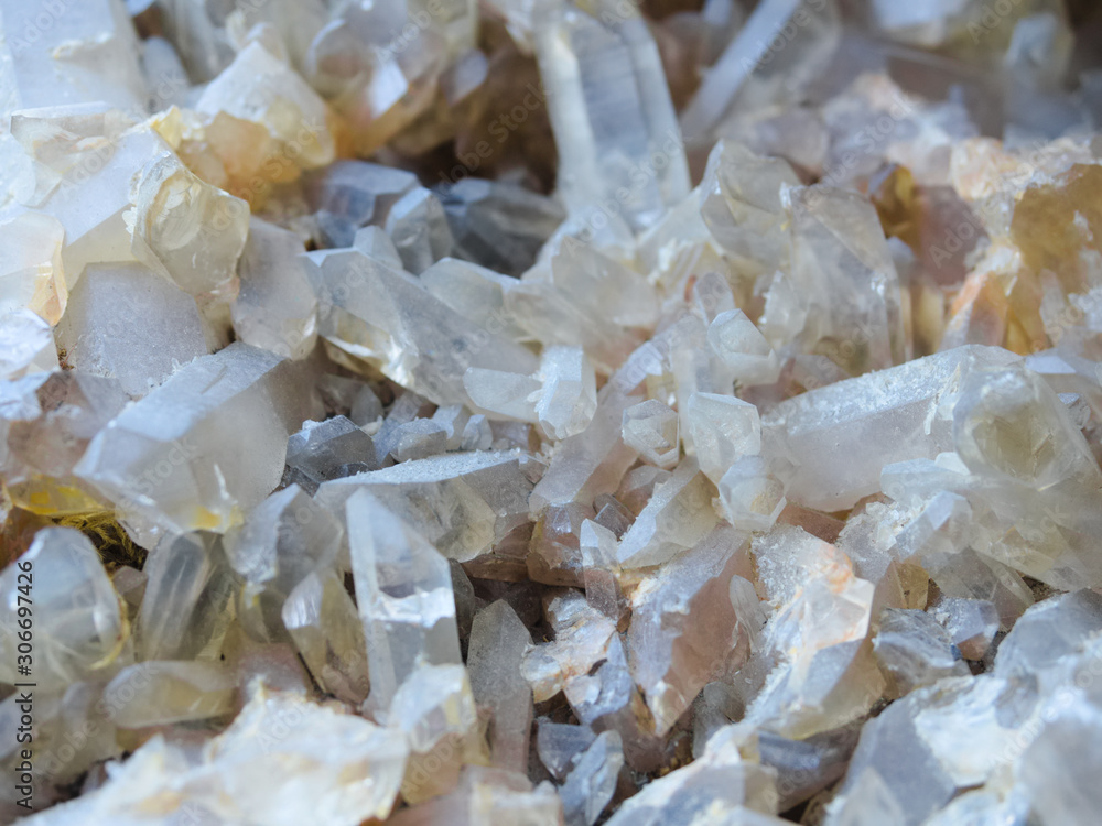 Background, smoky quartz crystals cluster close-up, in the rock. The most common mineral Background, smoky quartz crystals cluster close-up, in the rock. The most common mineral