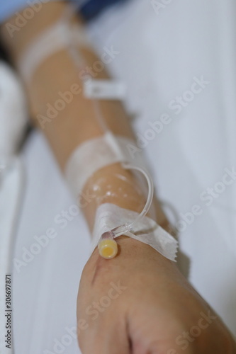 iv infusion intravenous injection of patient illness lying on bed