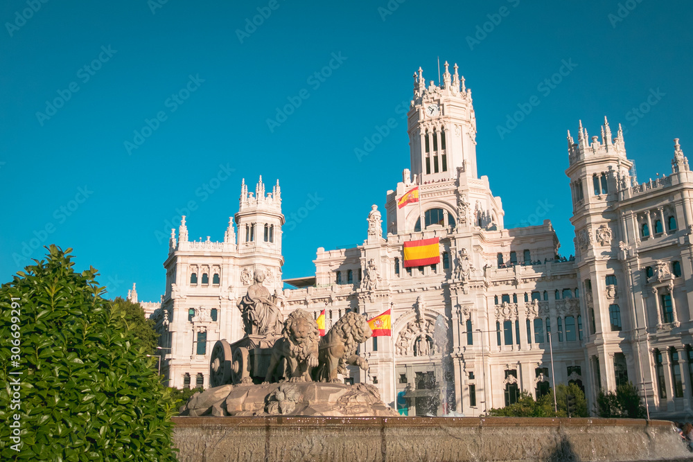 Cibeles fountain and Cibeles Palace at Plaza de Cibeles in Madrid in a beautiful summer day, Spain Cibeles fountain and Cibeles Palace at Plaza de Cibeles in Madrid in a beautiful summer day, Spain