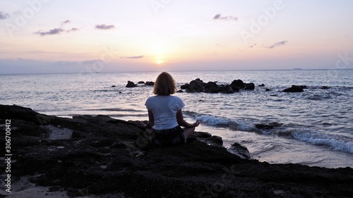 girl meditating practising yoga at the beach kimono thailand sunset © Magdalena Grzeszyk