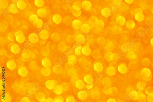 Golden yellow bokeh background. Concept for Christmas, New Year, Wealth, Prosperity, Happiness, Joyful and All Celebrations.